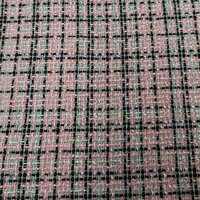 zwart roze boucl&eacute; tweed stof met subtiele glans