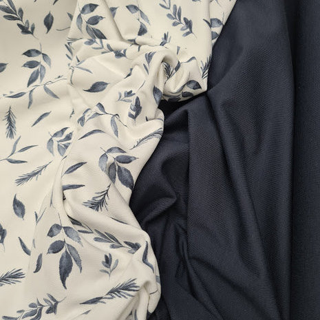 blauwe blaadjes en takjes met marine blauwe tricot uni