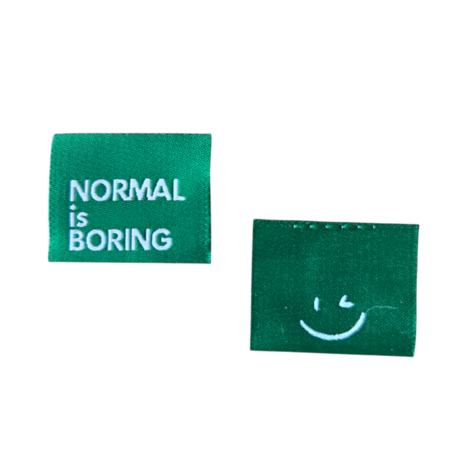 Label Normal is boring groen