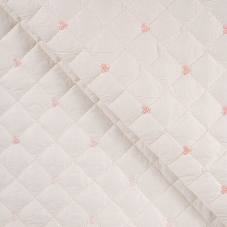 gevoerde jassenstof met broderie hartjes in zachte creme kleur