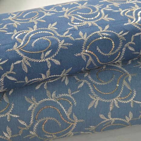Stretch denim broderie leafs met pailletten  KicKenStoffen