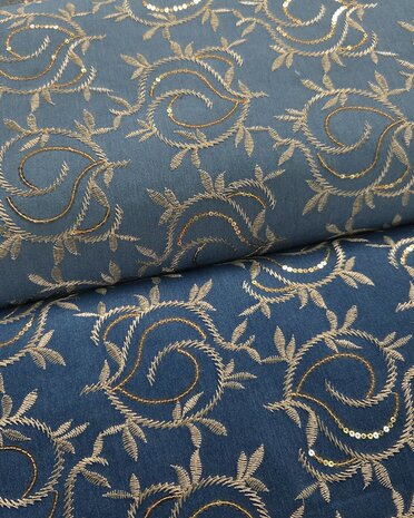 Stretch denim broderie leafs met pailletten  KicKenStoffen