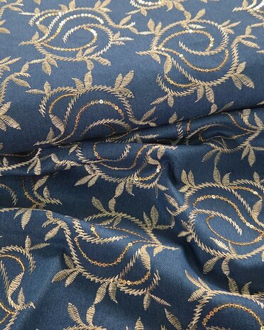 Stretch denim broderie leafs met pailletten  KicKenStoffen