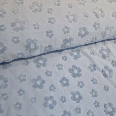 blauw (jeans licht) Bloemen badstof tricot (babybadstof) (op=op)