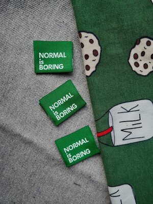 Label 'Normal is boring green'